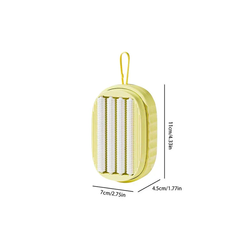 Laundry Scrub Brush - Yellow oval soap dispenser with hanging loop, showing internal textured rollers, with dimension labels