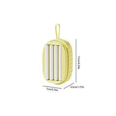 Laundry Scrub Brush - Yellow oval soap dispenser with hanging loop, showing internal textured rollers, with dimension labels