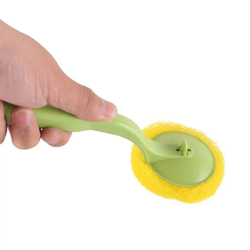 Soap dispensing brush held in hand showing ergonomic grip