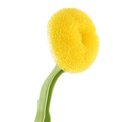 Soap Dispensing Brush - Close-up view of the yellow textured circular sponge brush head attached to the green brush handle.