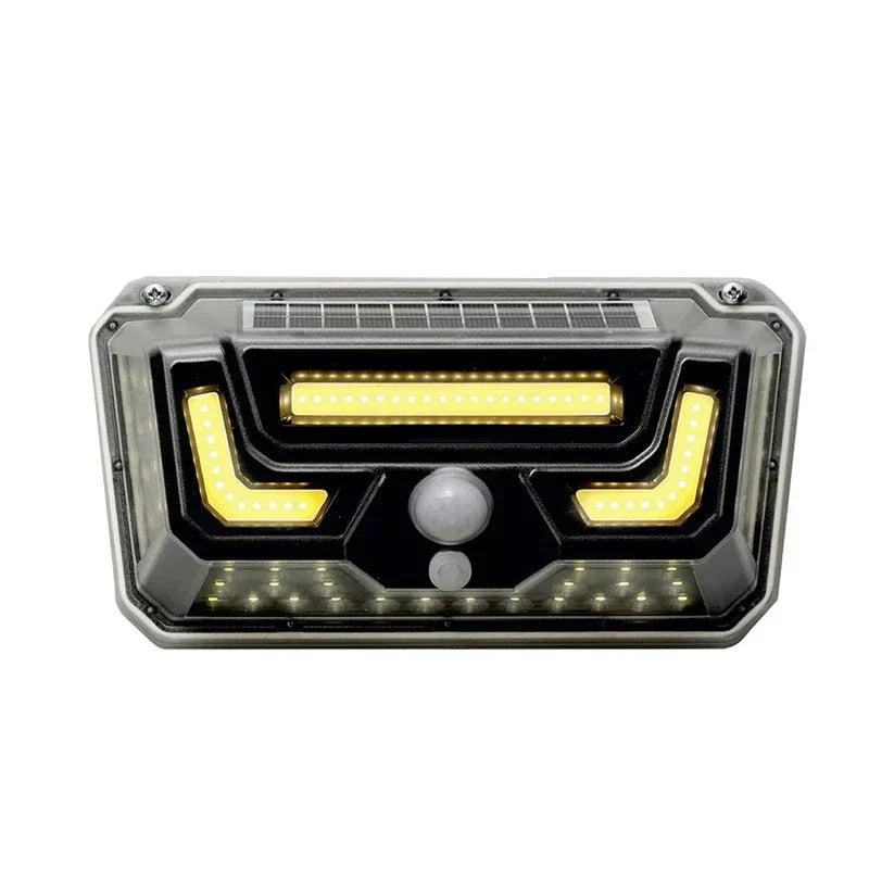 Torch Light - Front view of rectangular solar outdoor light with illuminated warm LED strips, top-mounted solar panel, and central motion sensor