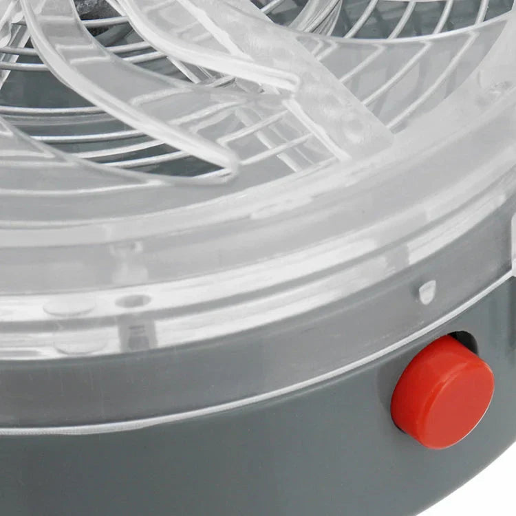repele animales con ultrasonido - Primer plano del botón lateral rojo en la base gris del dispositivo redondo, mostrando la rejilla en espiral transparente y la rejilla metálica interna