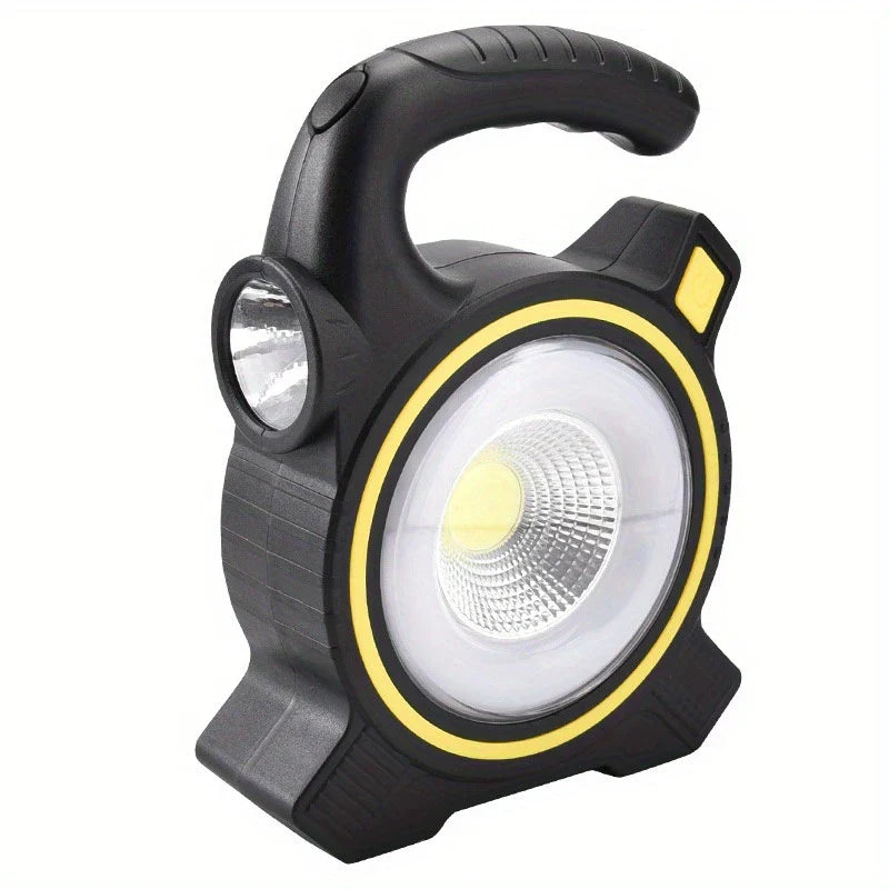 Black and yellow handheld camping lantern with side flashlight and power button on white background