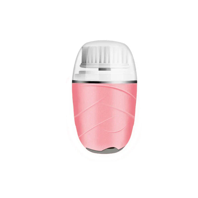 Pink handheld electric facial cleansing brush with clear protective cap over white bristle head