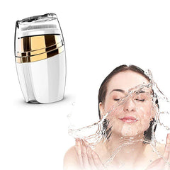 Sonic Facial Cleansing Brush - Cleansing device with exposed brush head next to person splashing water on face