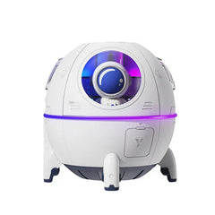 Humidifier Diffuser - White spherical space capsule-style humidifier with a small astronaut figure visible behind its front circular window, accented with purple and blue lighting