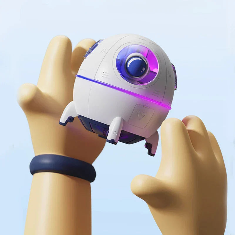 Humidifier Diffuser - Cartoon-style hands holding the small white astronaut pod device, showing its size against hands under bright light
