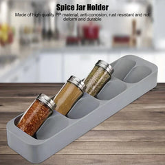 Spice Jar Organizer Box - Slotted tray holding three glass spice jars, placed on a wood kitchen countertop