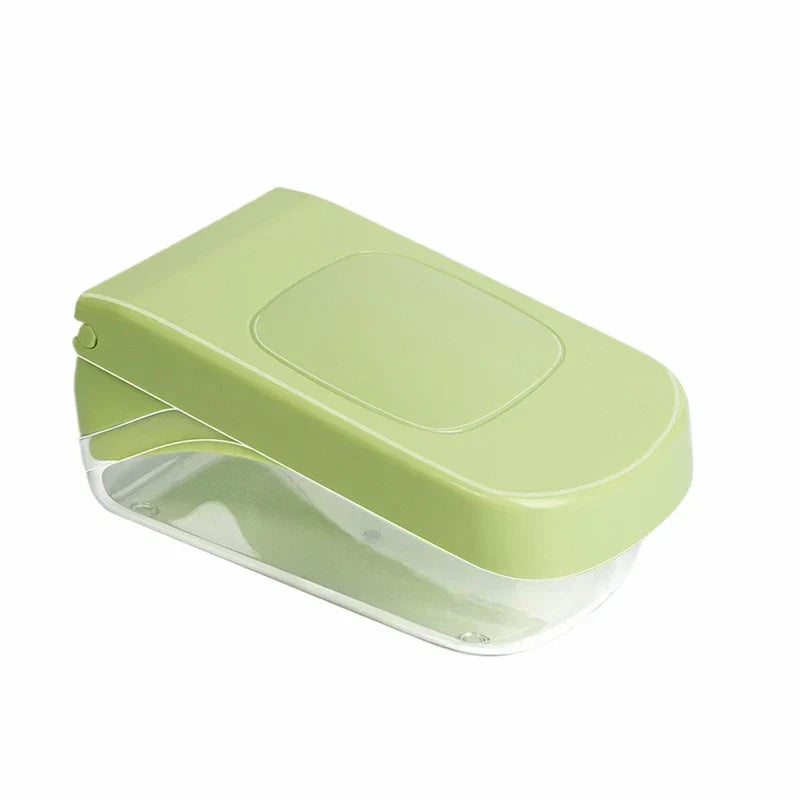 Closed light green plastic kitchen tool with a clear lower storage compartment, on a white background.
