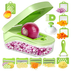 Open green multi-function veggie prep tool with diced onion in its clear bin, surrounded by interchangeable blade inserts and accessories.
