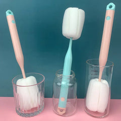 Sponge bottle cleaning brush wand on kitchen counter