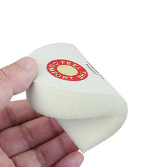 Sponge Heel Grips - A hand holding a flexible white sponge heel grip with a red printed logo, showing its bendable form