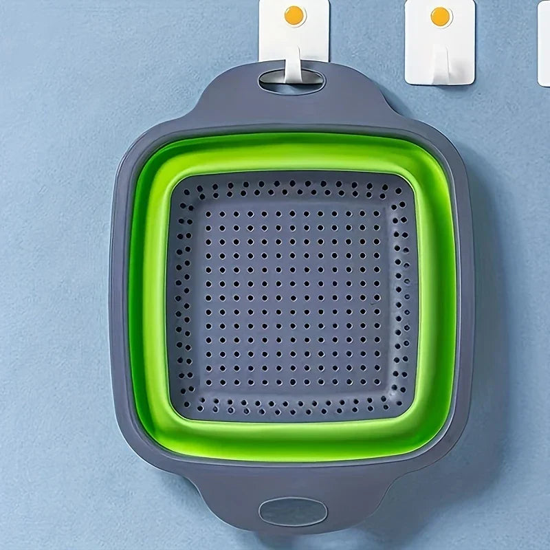 Square Plastic Colander Fruit Strainer Basket - Green and gray collapsible strainer hung from an adhesive wall hook