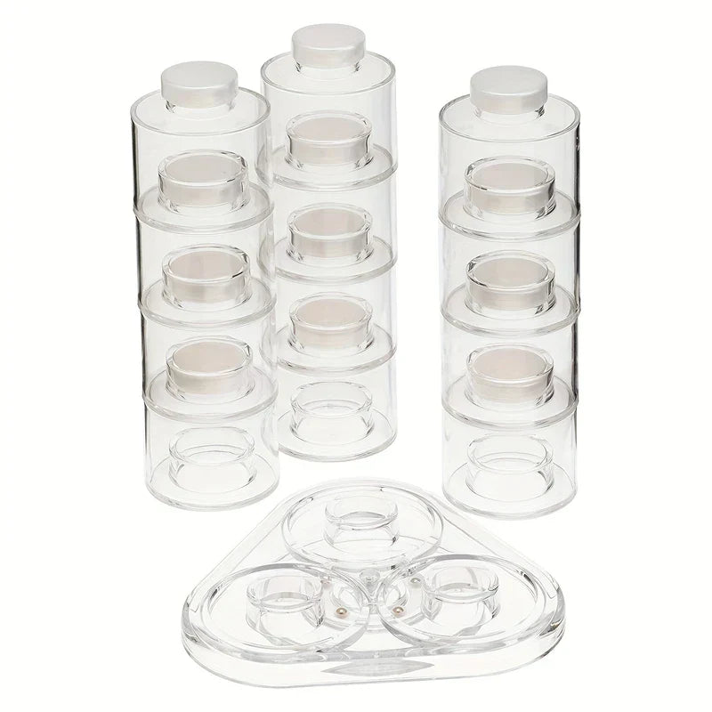 Spice Tower Jar Set - Three stacks of clear cylindrical containers separated from their triangular clear plastic base.