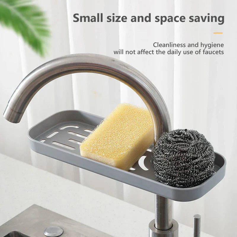 Stainless Steel Sink Caddy - Drain rack installed on a kitchen faucet holding a yellow sponge and steel wool scrubber