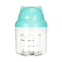 Cute cat-shaped turquoise garlic press mincer with clear container and internal blades on white background