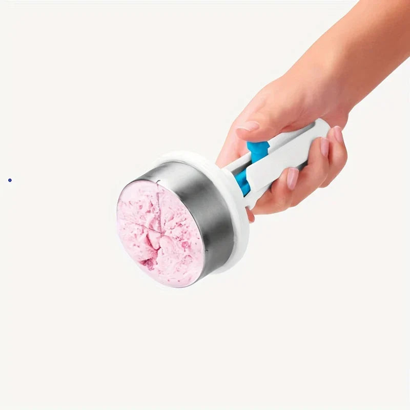 Hand holding a stainless steel ice cream scoop filled with pink ice cream against a light background