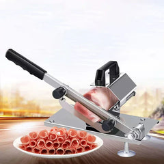 Mandoline Slicer - Manual slicer cutting frozen meat into thin curled slices, with a plate of finished sliced meat in the foreground