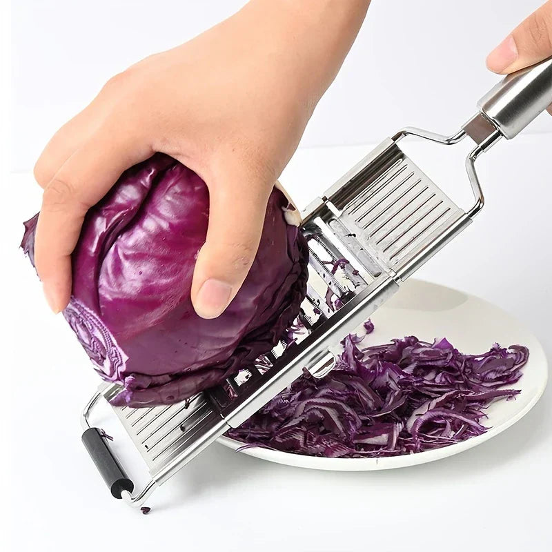 Vegetable Cutter - Multi-blade slicer shredding purple cabbage over a white plate