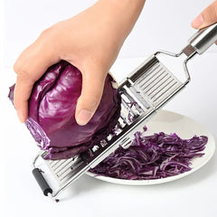Vegetable Cutter - Multi-blade slicer shredding purple cabbage over a white plate