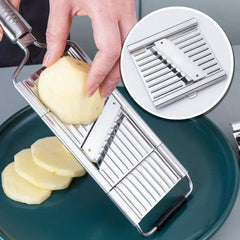 Vegetable Cutter - Slicer being used to cut a peeled potato into thick slices, inset shows the installed slicing blade