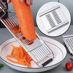 Vegetable Cutter - Multi-purpose vegetable slicer cuts carrot into long thin strips, inset shows the slicing blade.