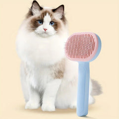 Pet Grooming Comb - Long-haired Ragdoll cat sitting next to the pastel slicker brush against a soft cream background