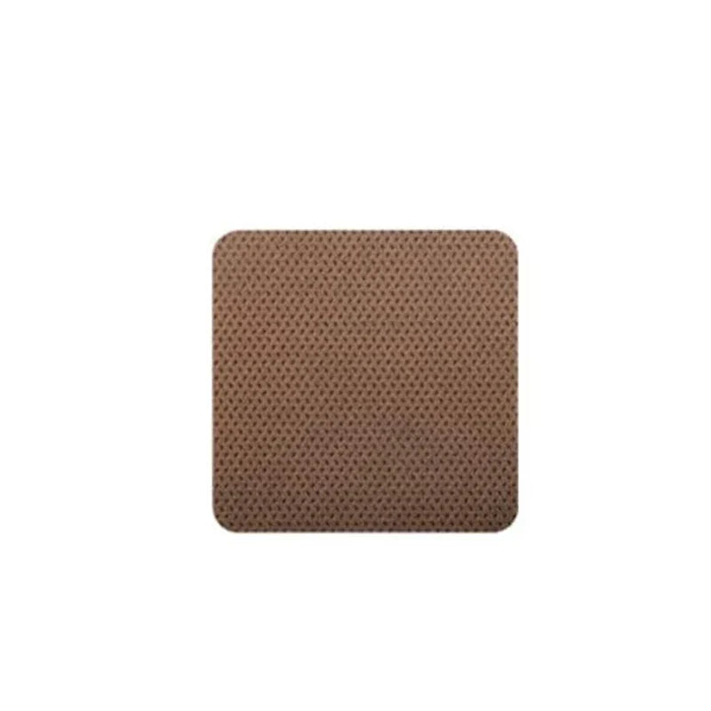 Single square brown textured nicotine patch against plain white background