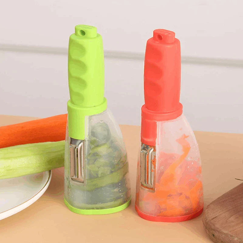 Storage Grater Box Container - Two storage-style vegetable peelers, one green and one red, sit on a light surface with peeled produce scraps inside their clear containers.