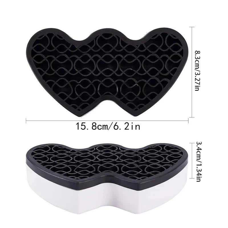 Storage Bin - Heart-shaped black and white organizer shown from top and angled side views, with labeled dimensions in cm and inches.