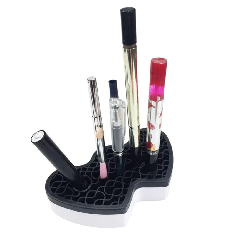 Storage Bin - Black and white heart-shaped organizer holding several upright and angled cosmetic pens.