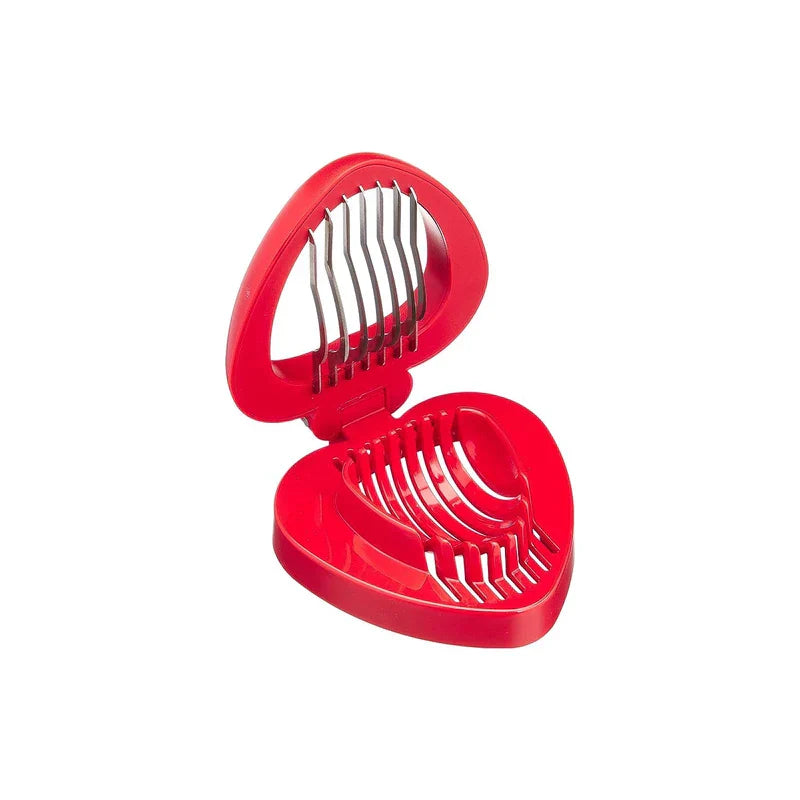 Open red plastic strawberry slicer with thin metal cutting blades, shown against a plain white background