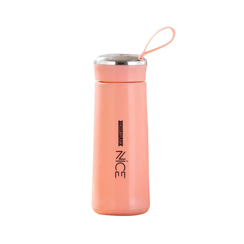 Peach plastic tumbler cup with a matching carry loop and silver-accented lid on a white background.