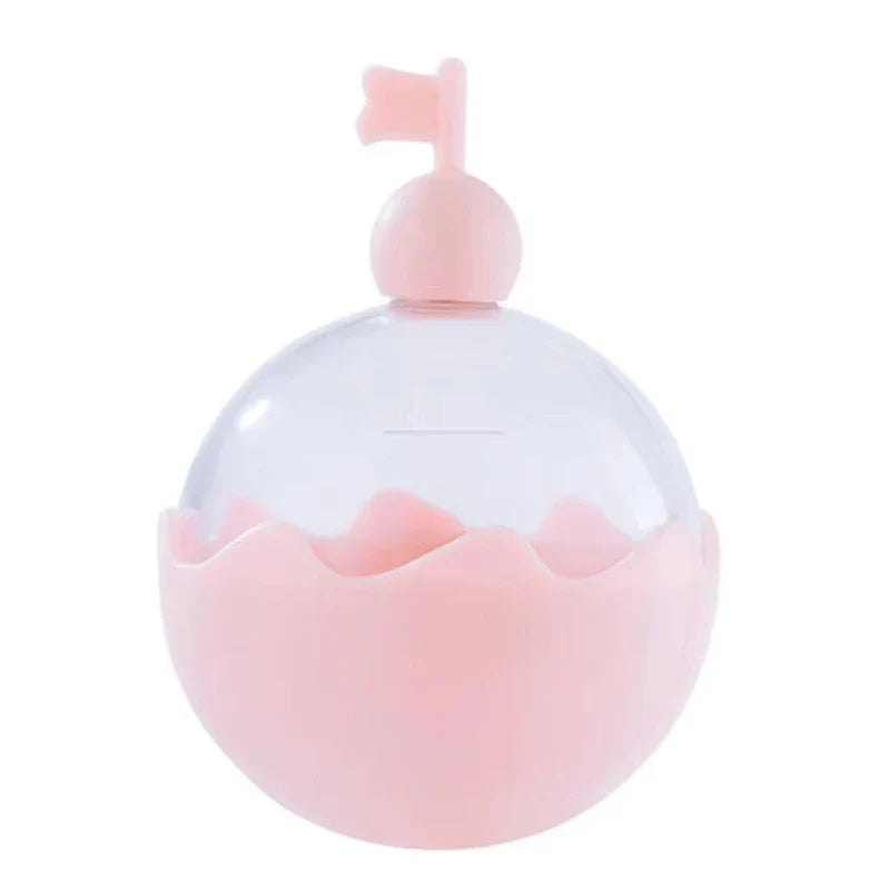 Ice Ball Mold - Round two-tone pink and clear plastic container with a small flag on its pink cap, on a plain white background