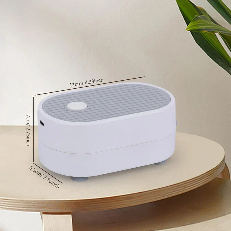Tea Tray Drainage Pipe - White and gray oval electronic device shown from an angled side view with dimension labels
