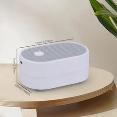 Tea Tray Drainage Pipe - White and gray oval electronic device shown from an angled side view with dimension labels