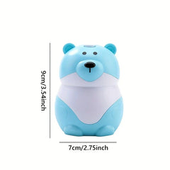 Sujetapalillos con forma de osito de peluche: recipiente de color azul claro con forma de oso de dibujos animados, mostrando marcas de dimensiones de 9 cm de alto y 7 cm de ancho