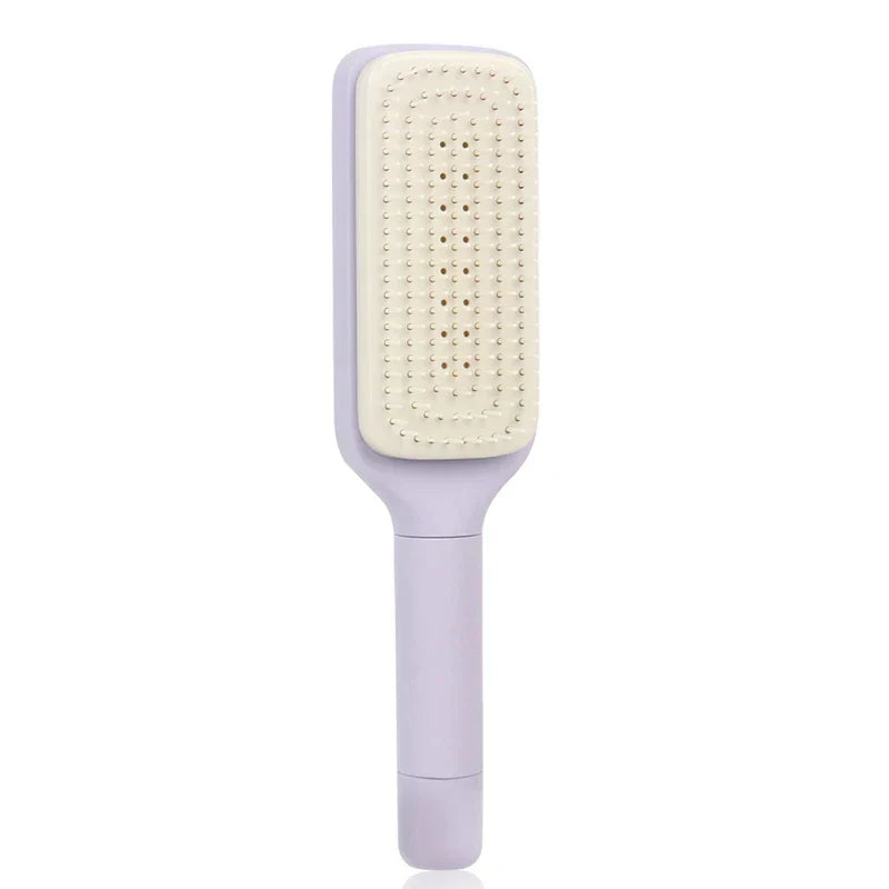 Front view of a light purple telescopic back scratcher with a smooth handle and beige bristle pad