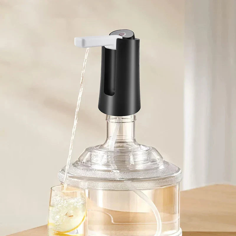 Electric Water Bottle Pump - Unit installed on a clear water jug dispensing water into a glass with lemon slices