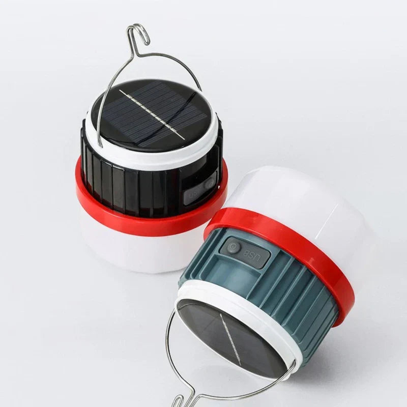Camping Lantern - Two variants of the hanging light, one upright and one tilted, showing solar panels on their tops.