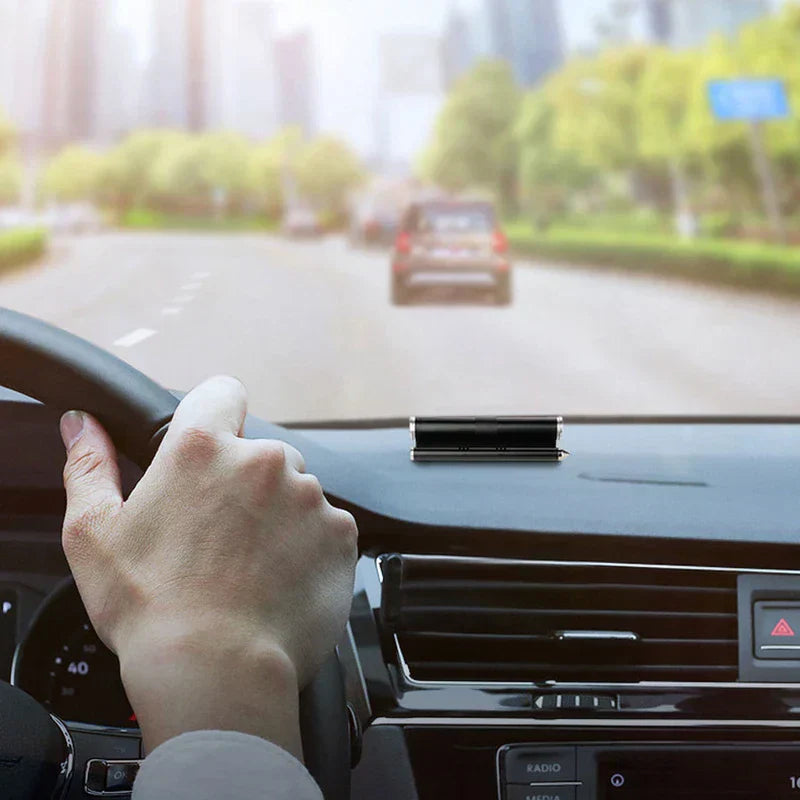 Temporary Parking Card Phone Number Plate Display - Black parking number device placed on a car dashboard, hand holding steering wheel visible