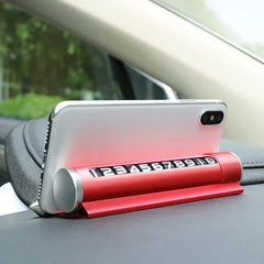 Temporary Parking Card Phone Number Plate Display - Red multi-function car phone mount with rotating number dial holding a smartphone on a car dashboard