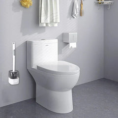 Wall mounted toilet brush set positioned beside a white toilet in a bathroom