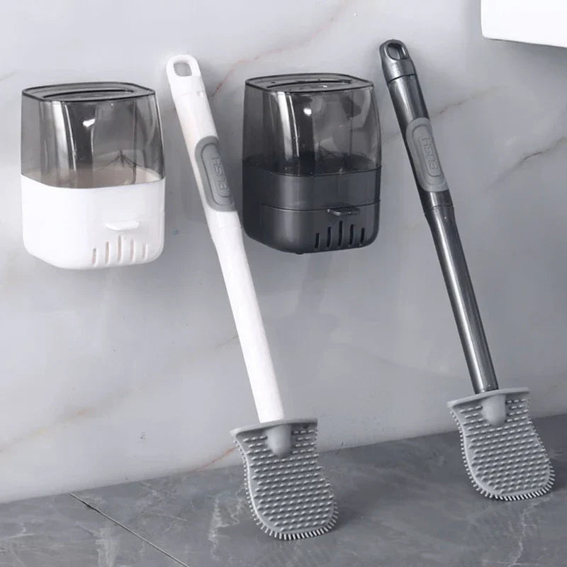 Two toilet brush sets with wall-mounted holders, one white and one dark gray, rest against a tiled wall.