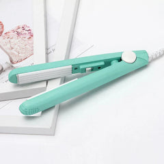 Sealing Tool - Mint green compact handheld heat sealer resting on stacked white frames