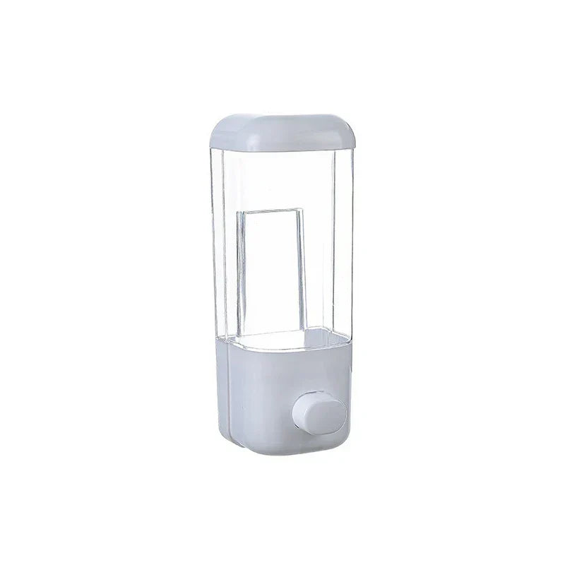 Empty clear and light gray travel set bottles dispenser with a front push button on white background