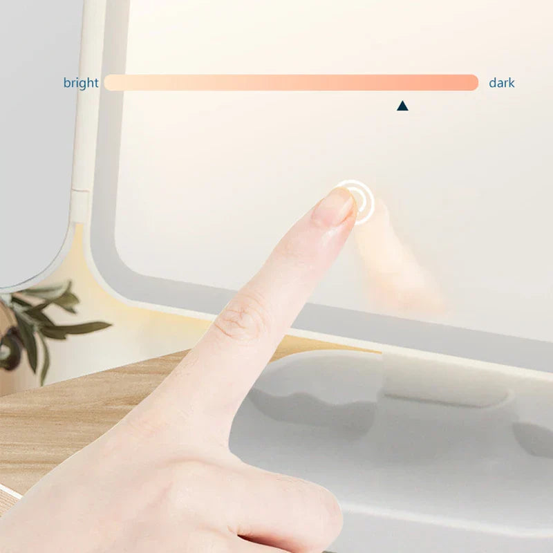 Makeup Mirror - Finger touching the touch control on a lit mirror, with bright-to-dark adjustment indicator displayed.