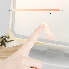 Makeup Mirror - Finger touching the touch control on a lit mirror, with bright-to-dark adjustment indicator displayed.