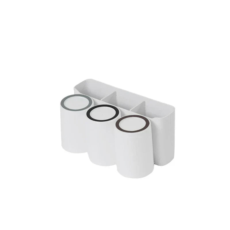 Triple toothbrush mouthwash cup holder set on a bathroom counter