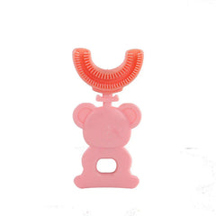Pink kids toothbrush u shaped with cartoon bear handle against white background